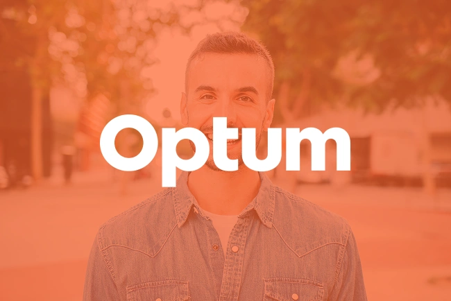 Man in denim shirt smiling at camera with warm orange overlay, dental office branding.